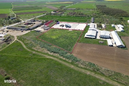 Teren industrial, betonat si imprejmuit cu utilitati si vad comercial