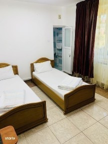 De inchiriat cladire 15 camere totul la parter