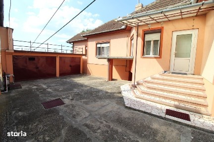 Vând casă D+P în Hunedoara, zona Chizid, teren 541mp, 2 garaje.