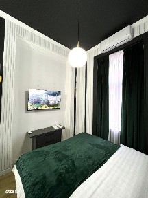 Central-Garsoniera tip Studio-Schimb cu teren intravilan