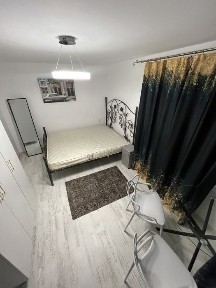 Chirie camera privata lux dar baia bucataria la comun centru tg cucu