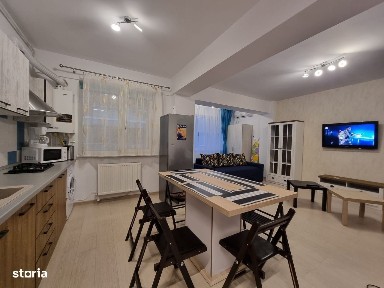 La 2 minute de mare, doua camere decomandate.