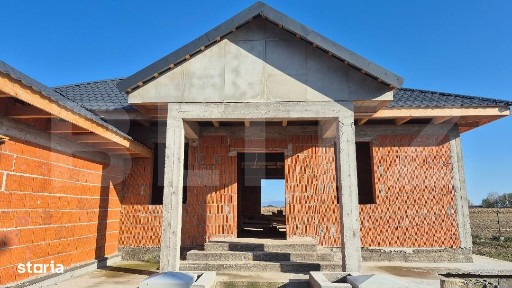 Casa la rosu, 4 camere, 145,31 mp utili, 715 mp teren, zona Martinesti