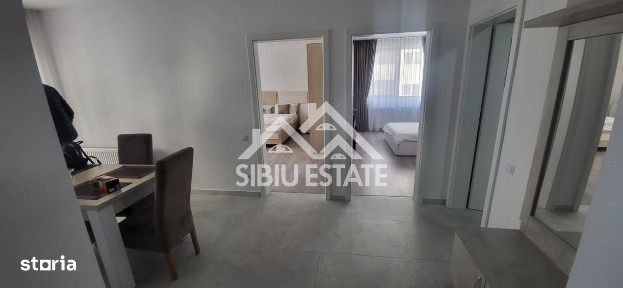 Apartament de inchiriat cu 2 camere, balcon, loc de parcare-mobilat si