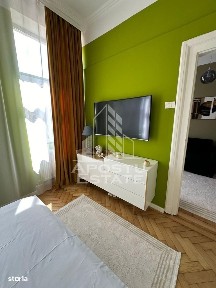 Airbnb ultracentral -85% ocupare, Piața Victoriei cladire restauranta