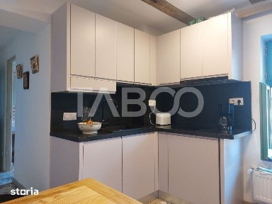 Apartament de vanzare 105 mp 3 camere curte 340 mp in acte Cisnadie