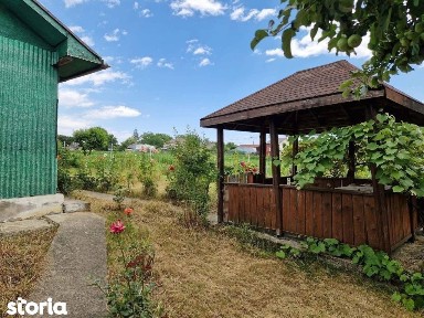 De vanzare casuta mica din caramida cu teren de 1059mp, 27.000euro