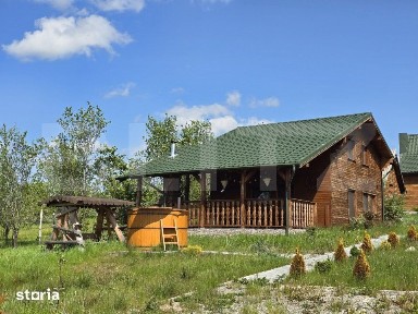 Cabana lemn cu 4 dormitoare, 120mp, teren intravilan de 1250mp
