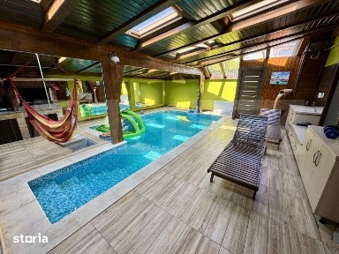 Casa de inchiriat, cu 4 dormitoare cu piscina, gratar, iaz si zona de