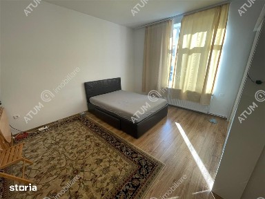 Apartament la casa cu 2 camere decomandate curte comuna central Sibiu
