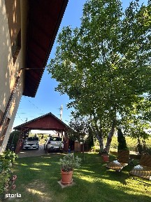 Casa 4 camere si teren de 1000 mp, garsoniera separata, foisor,carport