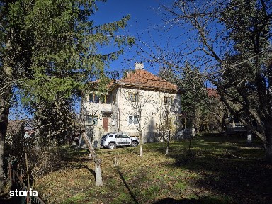 Teren 1.034 mp + casă două unități locative + potențial investiție