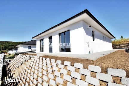 Casa pe 1 nivel,4 camere,2 bai,110 mp.1 dressing,500mp teren