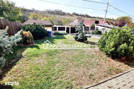 Casa 3 camere, 2 bai,1 garaj,teren 360 mp.zona Dambu Pietros
