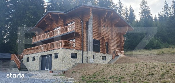 Cabana din bustean masiv si o suprafata de teren de 9000 mp in Vatra D
